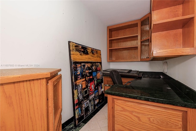 kitchen with light tile patterned flooring