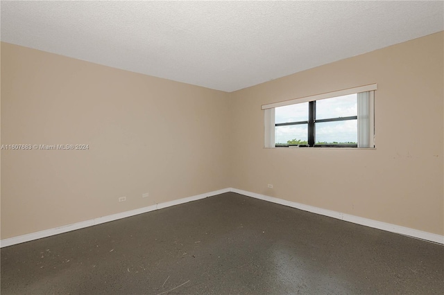 empty room with a textured ceiling