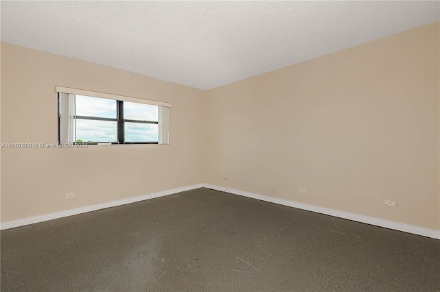 empty room with a textured ceiling