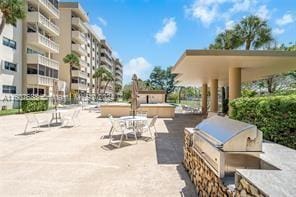 800 NE 195th St Unit 619, Miami, FL 33179 - view of patio with a grill