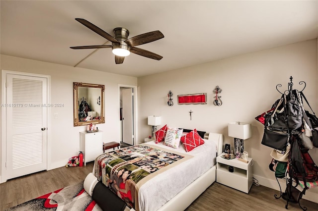 bedroom featuring ceiling fan and dark hardwood / wood-style floors