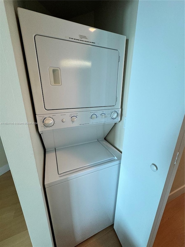 laundry area featuring stacked washer and dryer