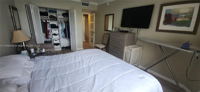 bedroom featuring a closet and hardwood / wood-style floors