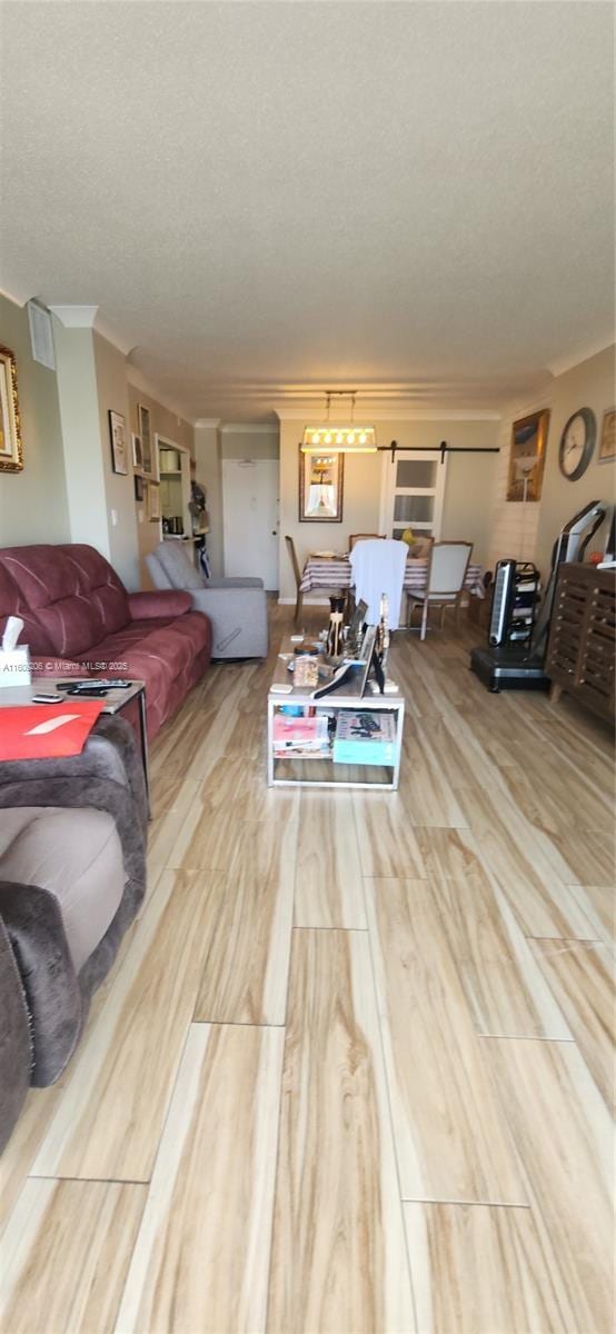 living room with hardwood / wood-style floors and a textured ceiling