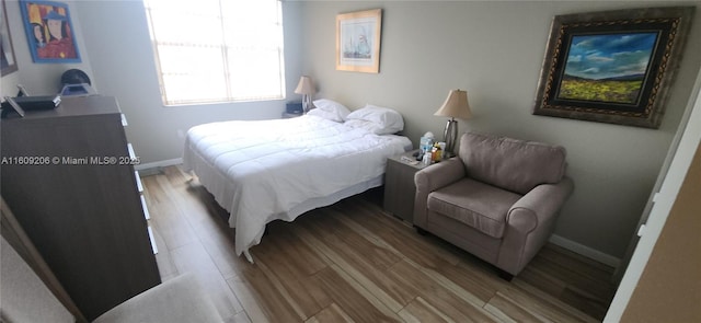 bedroom with light hardwood / wood-style floors