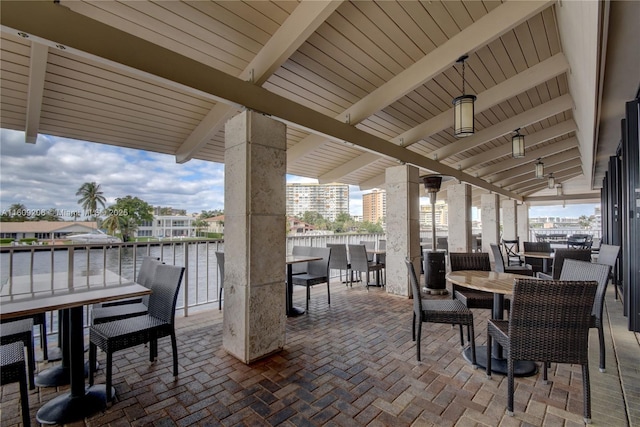 view of patio with a water view