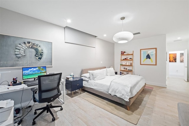 bedroom with light hardwood / wood-style flooring