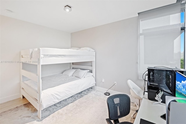 bedroom with light hardwood / wood-style floors