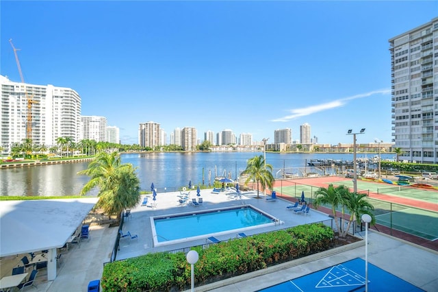 view of pool featuring a water view