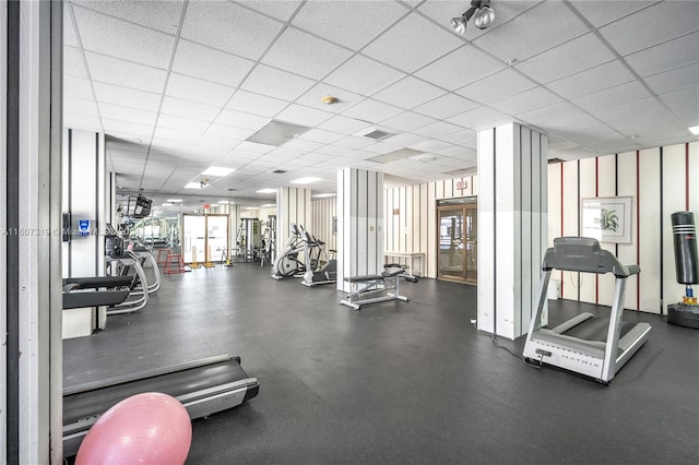 gym featuring a paneled ceiling