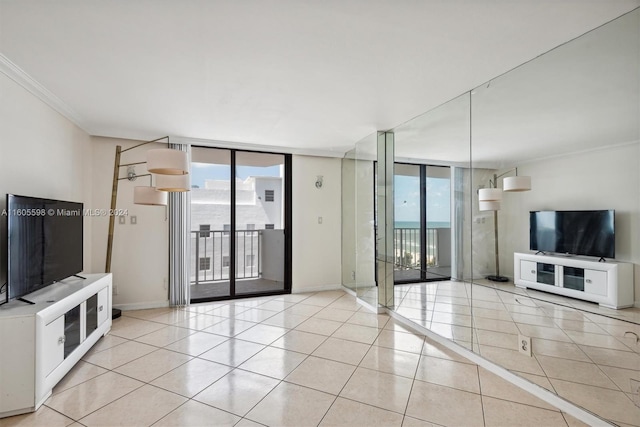 unfurnished living room with light tile patterned floors, expansive windows, and crown molding