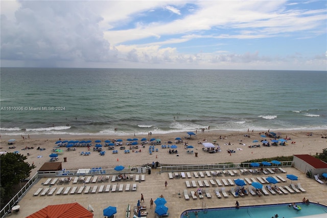 bird's eye view featuring a view of the beach and a water view