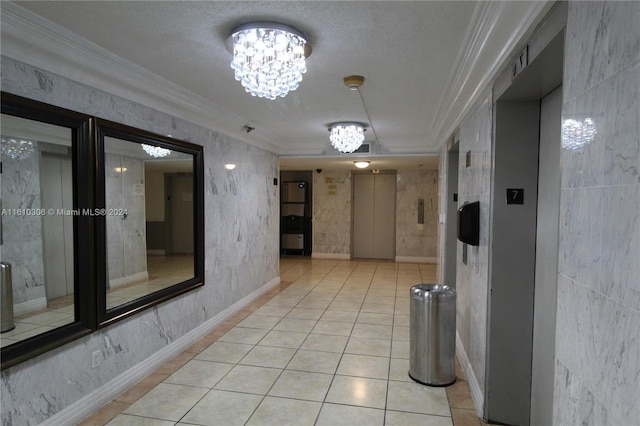 hallway with a textured ceiling, elevator, crown molding, and a notable chandelier