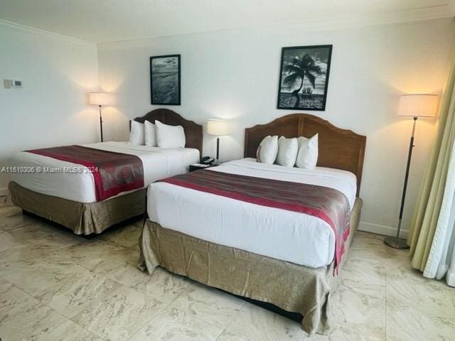 bedroom featuring ornamental molding