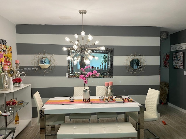 dining room featuring a notable chandelier and hardwood / wood-style floors