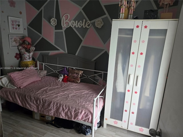 bedroom featuring hardwood / wood-style flooring