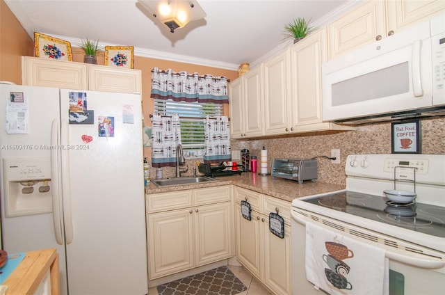 kitchen with tasteful backsplash, ornamental molding, white appliances, sink, and cream cabinets