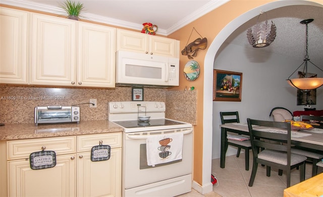 kitchen with crown molding, white appliances, cream cabinetry, decorative backsplash, and light tile patterned flooring