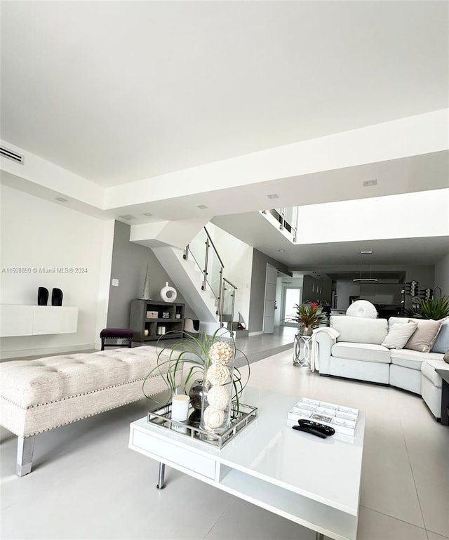 living room with tile patterned floors