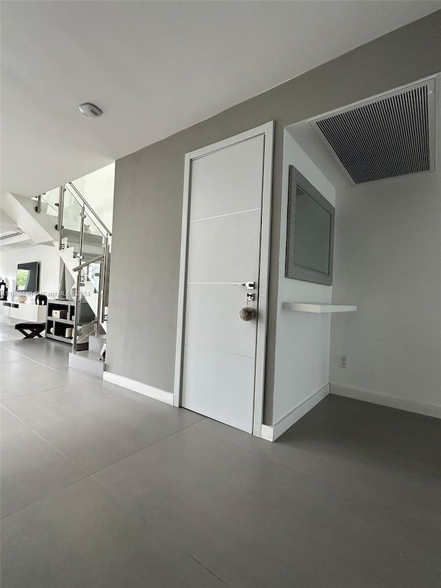 330 Poinciana Dr Unit 1002, Sunny Isles Beach, FL 33160 - interior space with baseboards, concrete flooring, and stairs