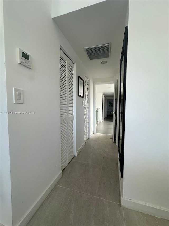 330 Poinciana Dr Unit 1002, Sunny Isles Beach, FL 33160 - hall featuring baseboards