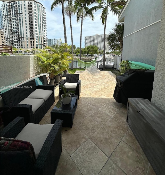 330 Poinciana Dr Unit 1002, Sunny Isles Beach, FL 33160 - view of patio / terrace with an outdoor living space
