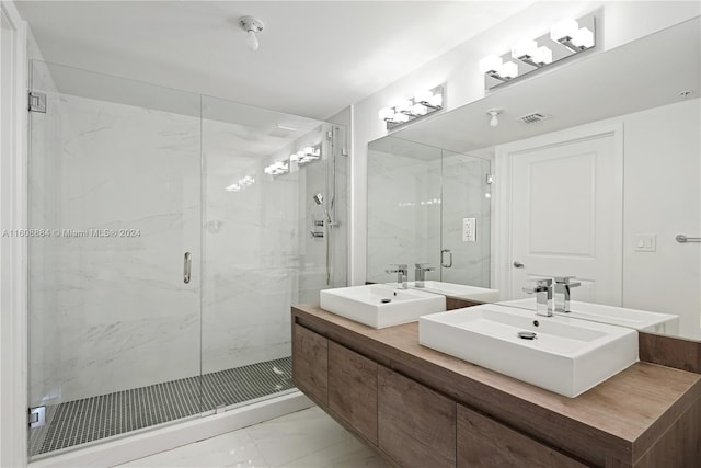 bathroom featuring vanity and an enclosed shower