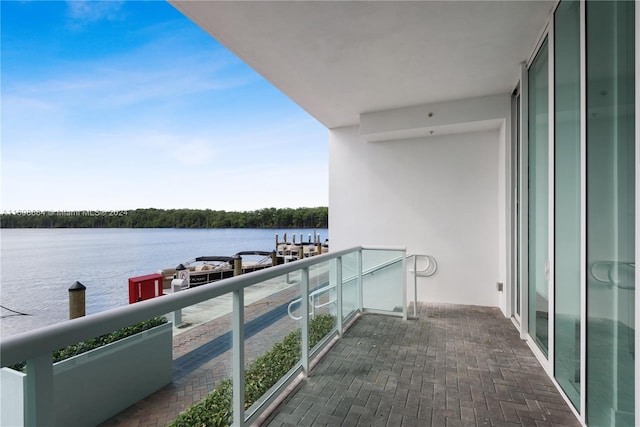 balcony featuring a water view