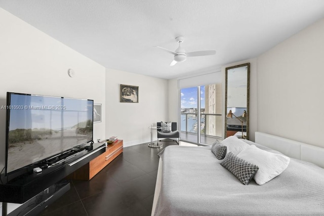 bedroom with ceiling fan, floor to ceiling windows, and access to exterior