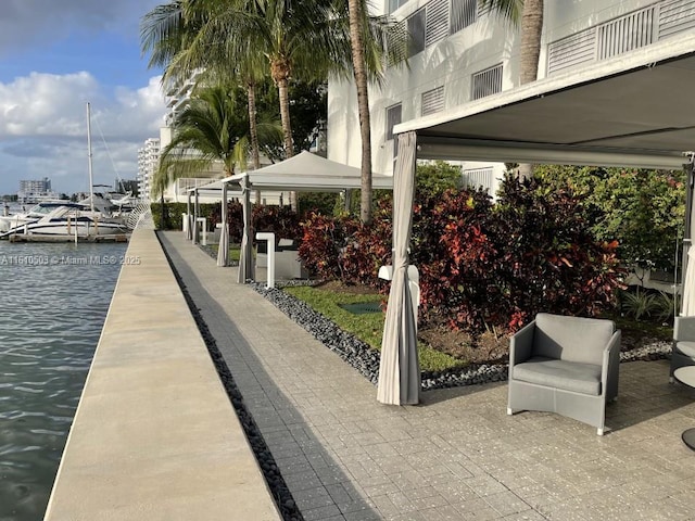 exterior space featuring a water view and a dock