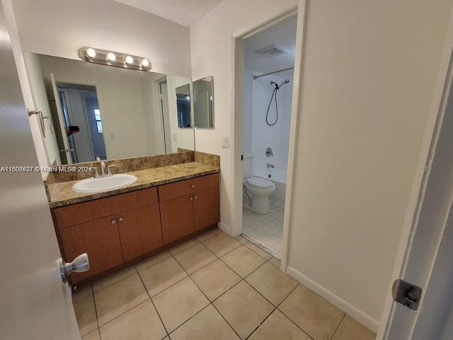 full bathroom featuring tile flooring, shower / bathing tub combination, toilet, and vanity