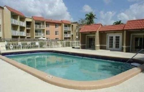 community pool with french doors