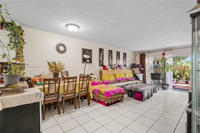 tiled living room with a textured ceiling