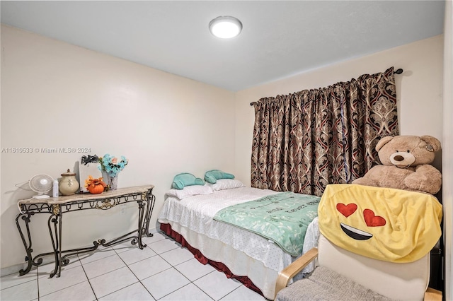 bedroom with light tile patterned floors