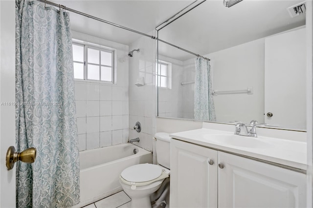 full bathroom featuring tile patterned floors, shower / bath combo, toilet, and vanity