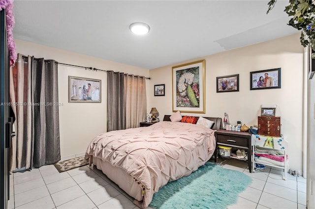 bedroom with light tile patterned floors