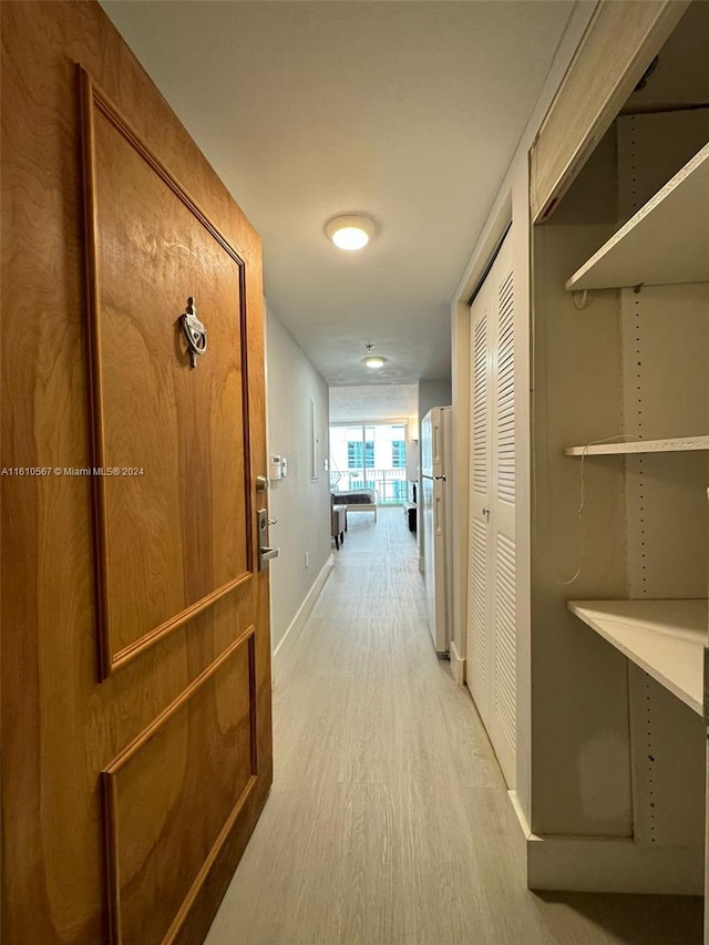 hallway featuring light wood-type flooring