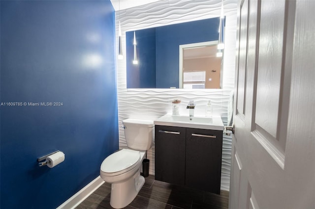 bathroom featuring decorative backsplash, vanity, and toilet