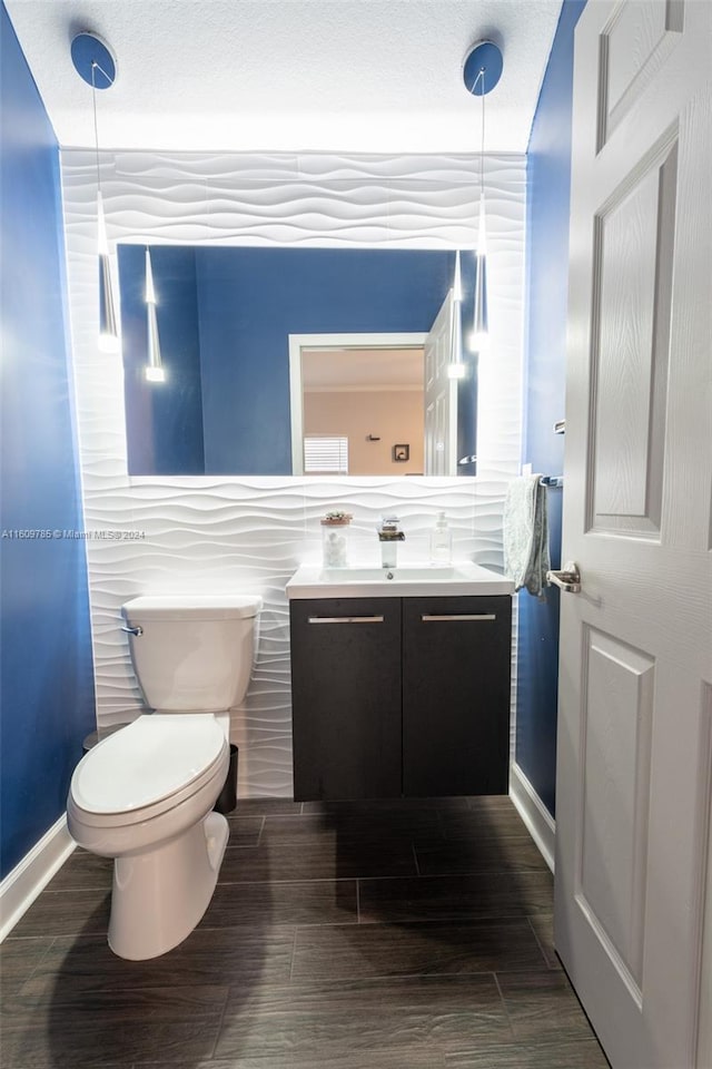 bathroom with toilet and vanity