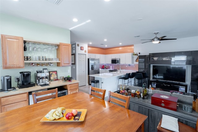 dining space with ceiling fan