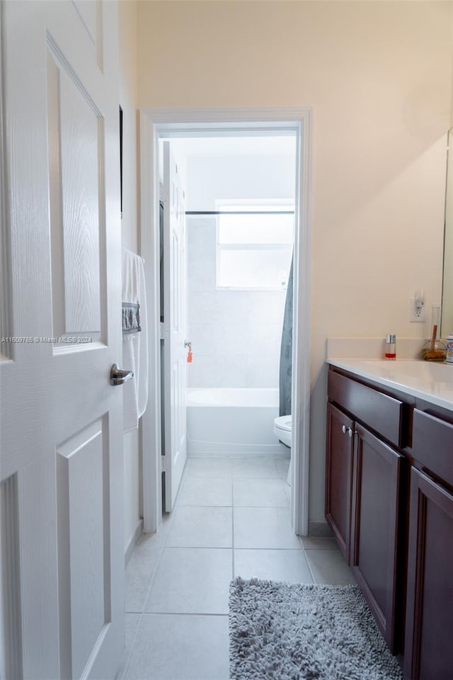 full bathroom with toilet, tile patterned flooring, bathtub / shower combination, and vanity