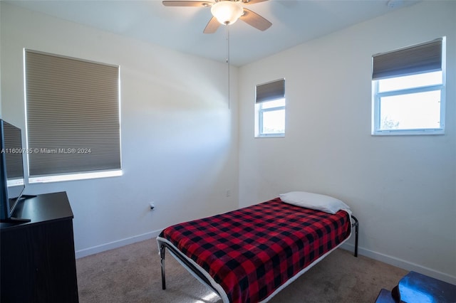 carpeted bedroom featuring ceiling fan