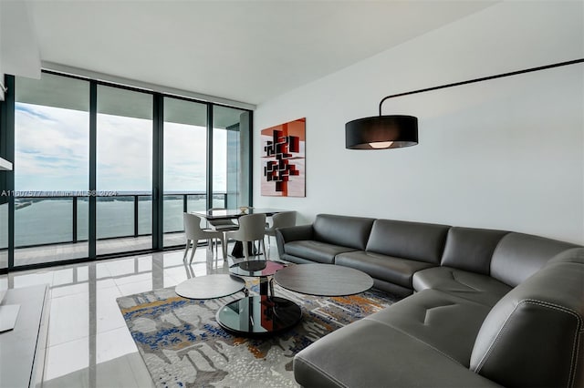 living room with a water view and floor to ceiling windows