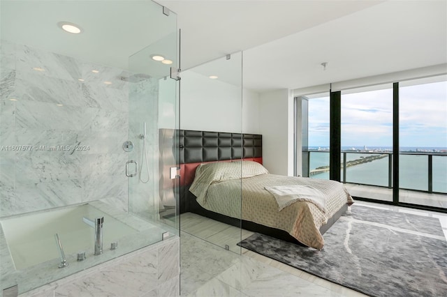 bedroom featuring expansive windows, a water view, and access to outside