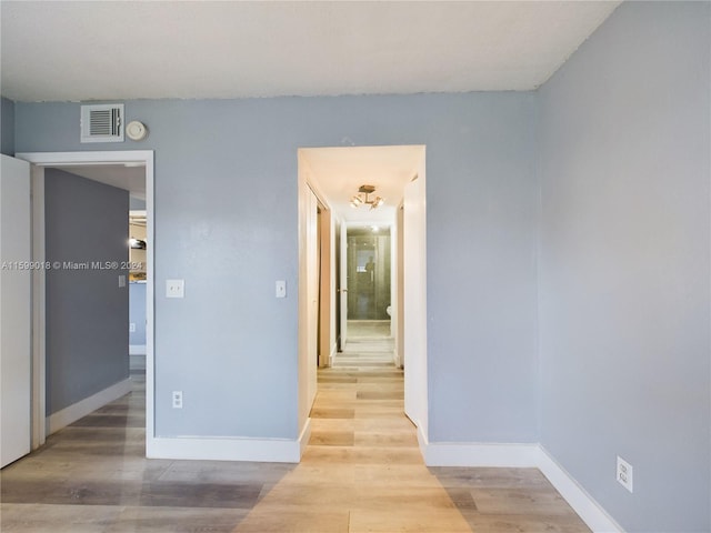 unfurnished room featuring light hardwood / wood-style floors