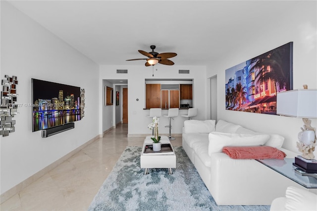 living room featuring ceiling fan