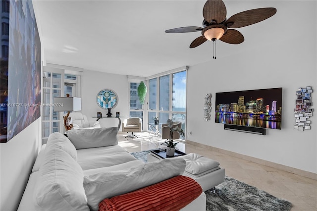 living room featuring tile patterned floors, floor to ceiling windows, and ceiling fan