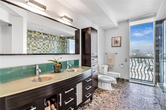 bathroom featuring floor to ceiling windows, a bidet, toilet, vanity, and a shower with shower door