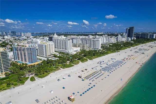 birds eye view of property featuring a view of the beach and a water view