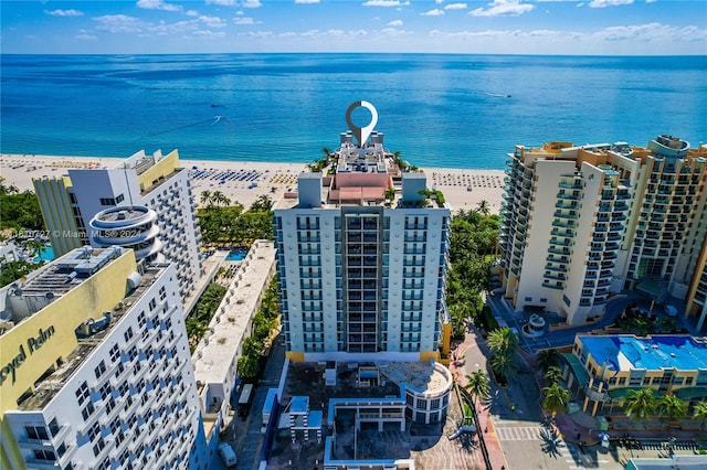 drone / aerial view with a view of the beach and a water view